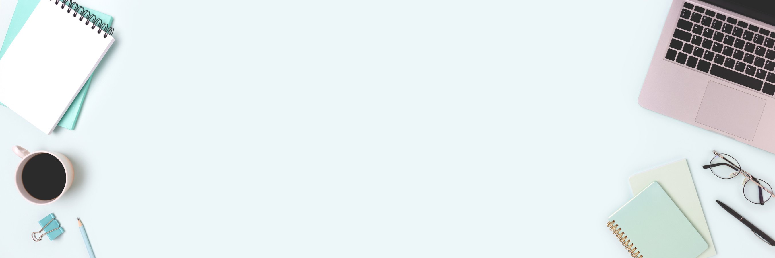 Banner with laptop and stationery on a blue background.